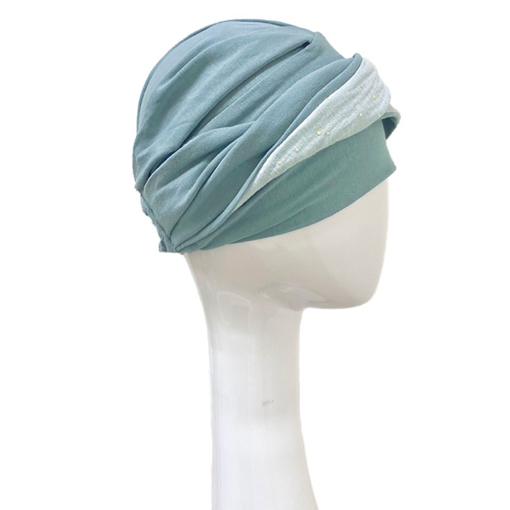 Vista lateral del turbante Elegance Aguamarina Gold